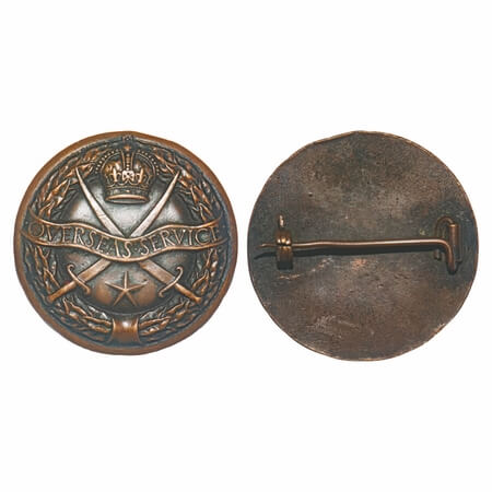 British India, Copper Badge, 21.00g, Cross Swords and Star, Overseas Service, garland arou